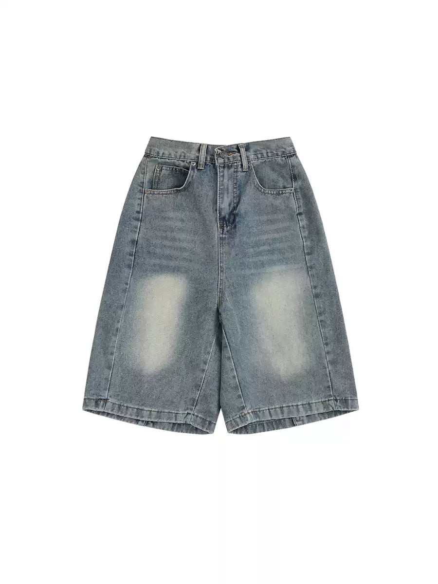 Pair of light blue denim shorts on a white background