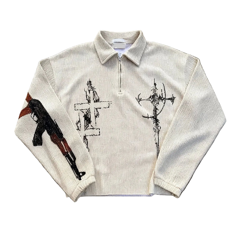 White long-sleeve shirt with black and red graphics on a textured brown surface