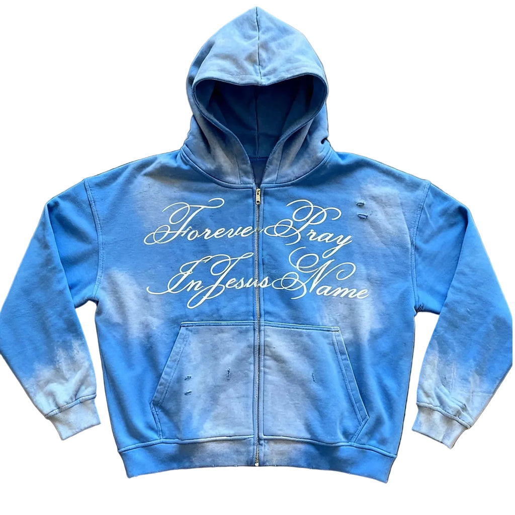 Blue hoodie with text on a brown surface