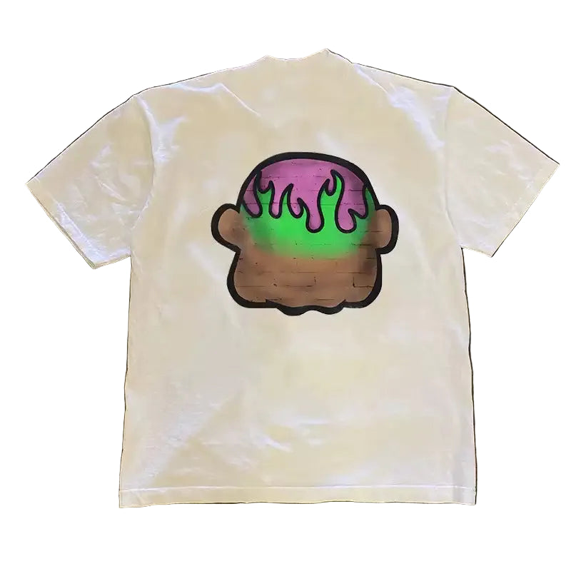 White t-shirt with a colorful graphic of a donut on a textured brown background